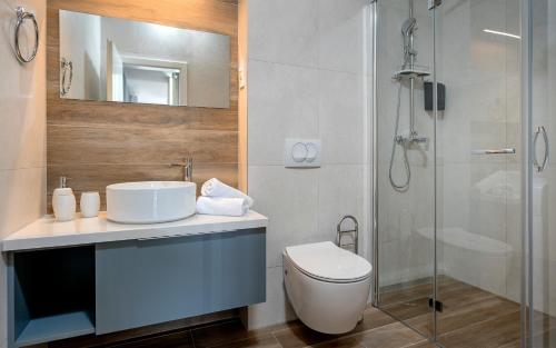 a bathroom with a toilet and a sink and a shower at Sun&Lux Resort - Hvar in Hvar