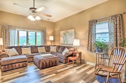 a living room with a couch and a ceiling fan at Spacious Sturgis Retreat with Black Hills View! in Sturgis