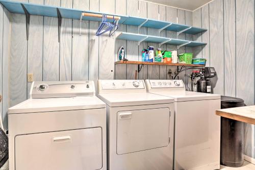 a laundry room with two washing machines and a counter at Spacious Sturgis Retreat with Black Hills View! in Sturgis