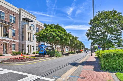 an empty street in a town with trees and buildings at Charming Hampton Home with Yard 2 Mi to Beach! in Hampton