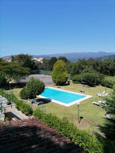 an image of a swimming pool in a yard at Quinta Do Fijo in Arcos de Valdevez