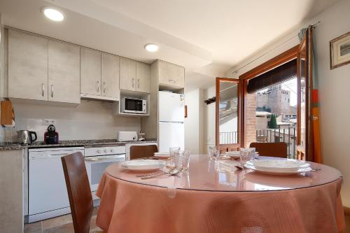a kitchen with a table with a table cloth on it at Bellavista 2 in Alquézar
