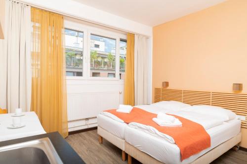 Posteľ alebo postele v izbe v ubytovaní Apartments Favoriten