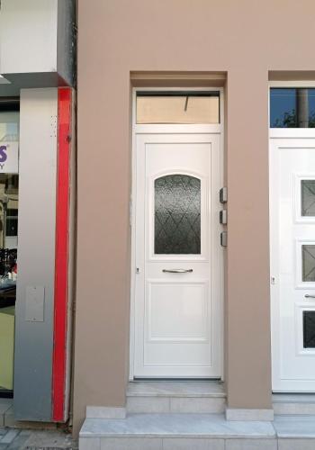 a white door on the side of a building at Old Town Comfort by Irini in Kos Town
