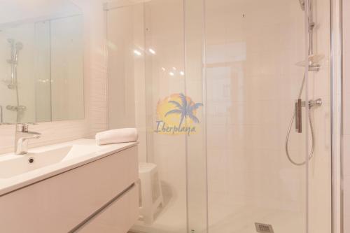 a bathroom with a shower and a sink and a toilet at NOVELTY IBERPLAYA in Salou