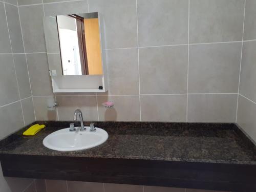 a bathroom with a sink and a mirror at CATA 1. SAN JOSE ENTRE RIOS in San José
