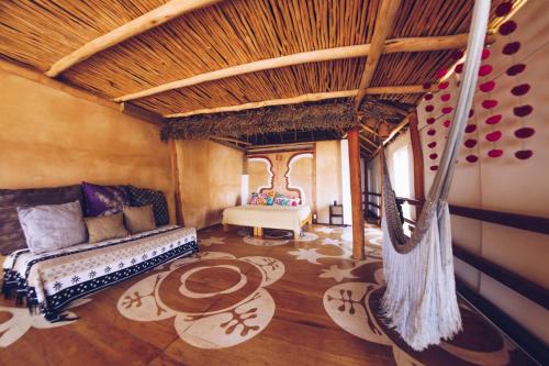 a living room with a couch and a hammock at Casa Love in Sayulita