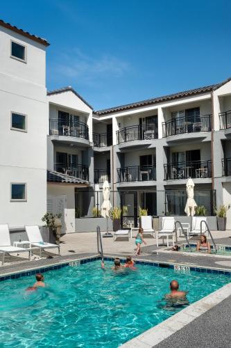 a group of people in the swimming pool of a hotel at Ocean Park Inn in San Diego