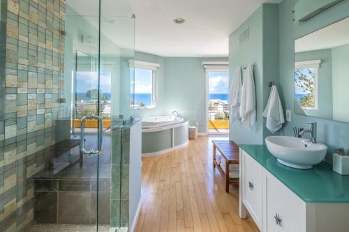 a bathroom with a shower and a sink and a tub at Beach Resort Home with Ocean Views Jacuzzi & Sauna! in San Diego