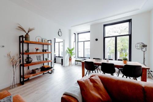 a living room with a couch and a table at LVM Stays in The Hague