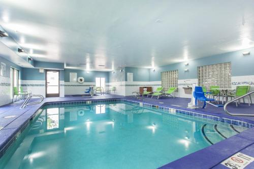 a pool with blue water in a hotel room at  Holiday Inn Express & Suites in Santa Fe