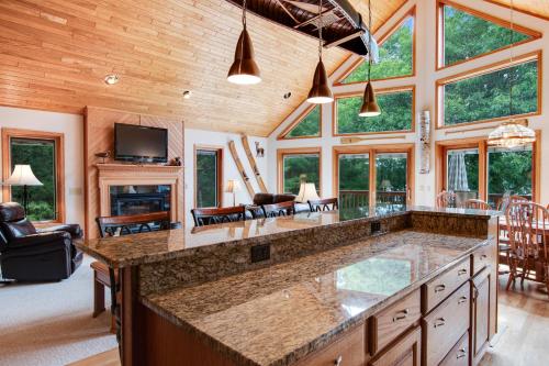 an open kitchen with a large island in a house at GolfView GetAway in Eagle River