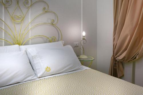 Ένα ή περισσότερα κρεβάτια σε δωμάτιο στο Residenza Borbonica