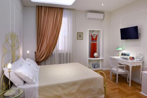 Ένα ή περισσότερα κρεβάτια σε δωμάτιο στο Residenza Borbonica