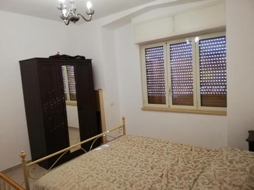 Ein Bett oder Betten in einem Zimmer der Unterkunft pozzuoli-licola mare