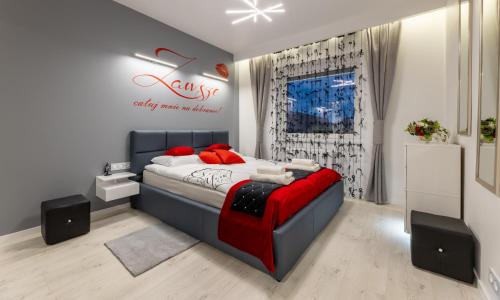 Posteľ alebo postele v izbe v ubytovaní Leo Apartament Delux