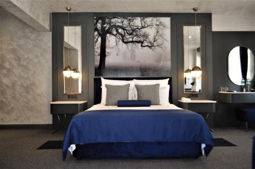 Ένα ή περισσότερα κρεβάτια σε δωμάτιο στο Skopea Inn Exclusive Hotel