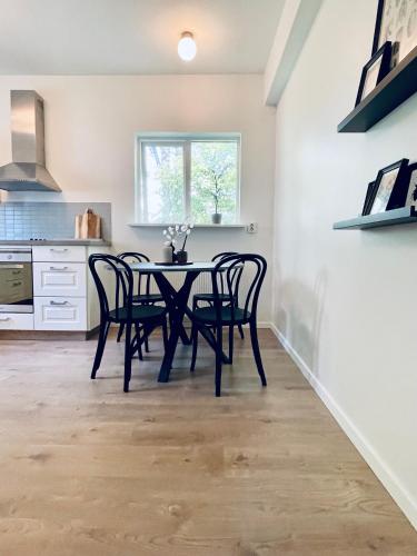 a dining room with a table and chairs at Day Dream Soleyjargata Rooms & Apartments in Reykjavík