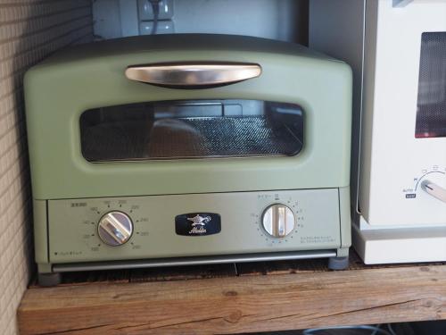 a toaster oven sitting on top of a counter at Minanonno Play Village in Yoichi