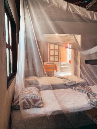 Mais Que Nada Itacaré - Hostel, Bar & Breakfastにあるベッド