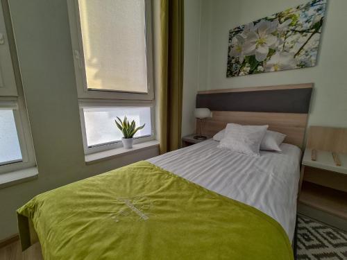 Postel nebo postele na pokoji v ubytování Antonińska Hotel & Apartamenty