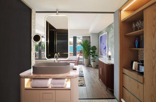 a bathroom with a sink and a mirror at Mondrian Seoul Itaewon in Seoul