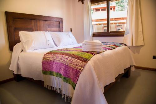Postel nebo postele na pokoji v ubytování Cabañas Santa Margarita