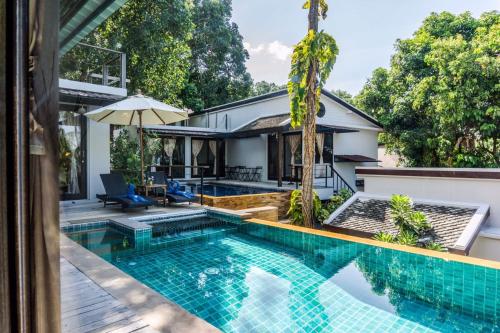 an image of a swimming pool in front of a house at Sasitara Residence in Chaweng