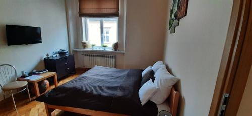 
Łóżko lub łóżka w pokoju w obiekcie Apartments Sobieski&Soplica
