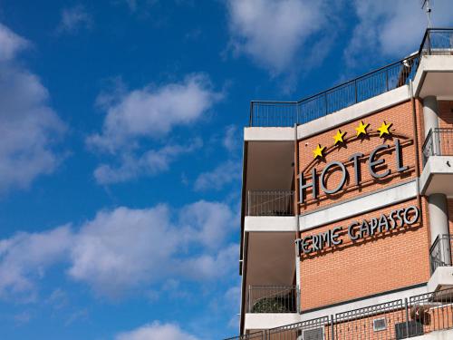 a hotel sign on the side of a building at Hotel Terme Capasso in Contursi