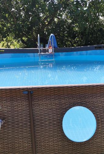 a swimming pool with a water slide in it at Casa Re - B&B e Vino a Montabone in Montabone