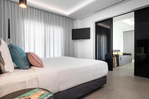 Tempat tidur dalam kamar di Balia Suites