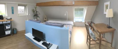 Ένα ή περισσότερα κρεβάτια σε δωμάτιο στο Bed & Breakfast Ter Borg