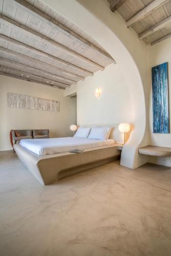 a bedroom with a large bed in a room at Villa Aegean Lighthouse in Fanari