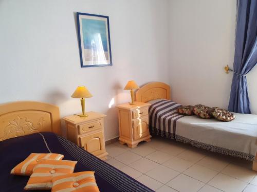Letto o letti in una camera di La Colline de Chott Meriem appartements