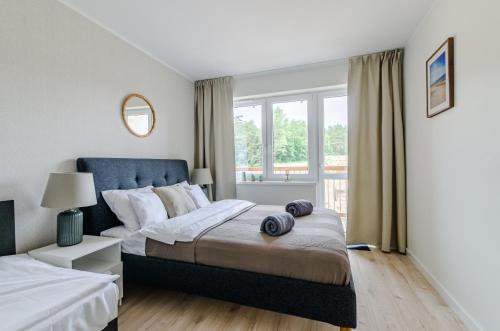 Cama ou camas em um quarto em NADMORSKI KLIF