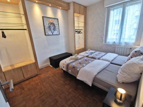 Postel nebo postele na pokoji v ubytování Le Robinson - Les Maisons de Madeleine