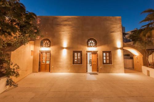 an exterior view of a building with doors at Casasantantonio 18th Century Luxury Mansion in Fira