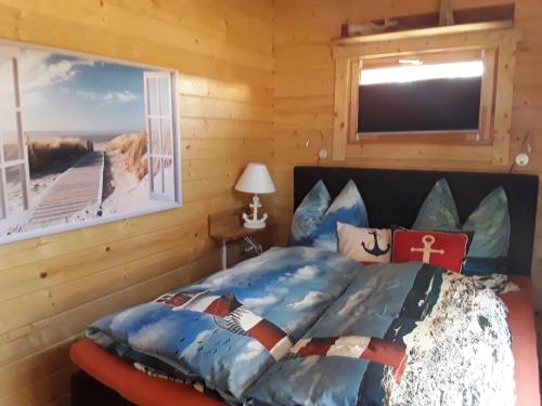 Ferienhäuser Seeblick tesisinde bir odada yatak veya yataklar