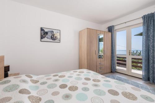 Postel nebo postele na pokoji v ubytování Apartments Vilma