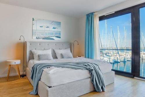 Ένα ή περισσότερα κρεβάτια σε δωμάτιο στο Captain's Home Heiligenhafen