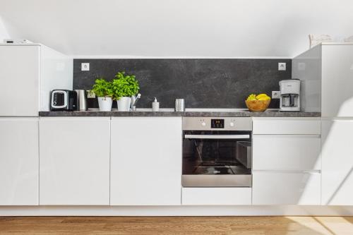 Dapur atau dapur kecil di Fischerdorf Hafenloft (mit Meerblick)