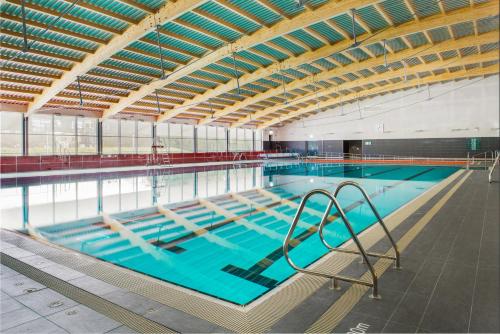 a large indoor swimming pool with a large pool at Lough Lannagh Self Catering Cottages in Castlebar