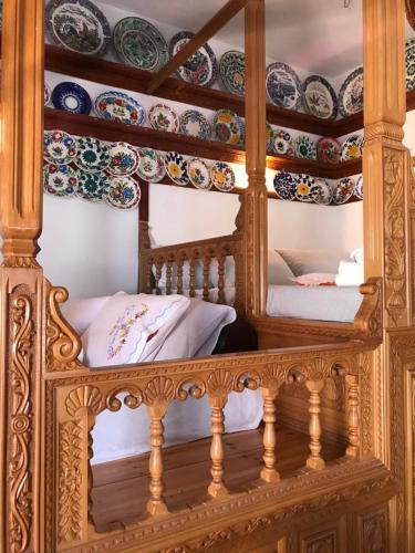 a room with a bed and plates on the wall at Traditional House of Diafani in Karpathos Town