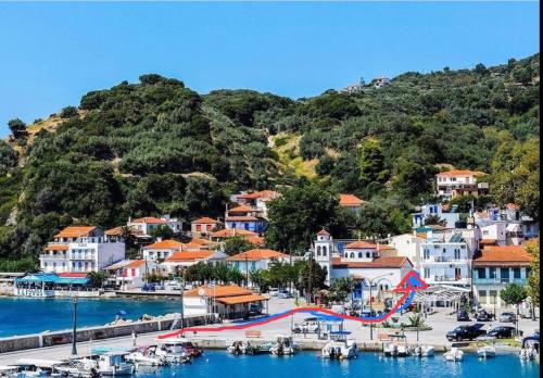 a view of a town with boats in a harbor at MarKaMar in Loutraki