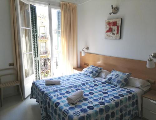Cama o camas de una habitación en Hostal Felipe 2