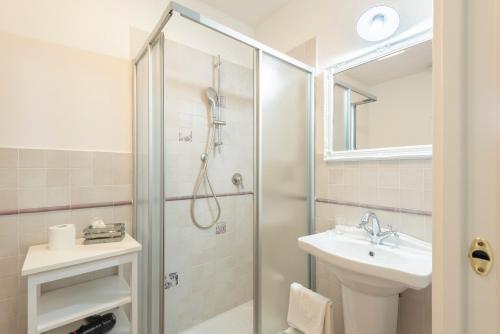 a bathroom with a shower and a sink at Fattoria Pian Di Rocca in Castiglione della Pescaia