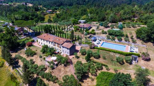 an aerial view of a house with a swimming pool at Residence al Foionco in Lucca