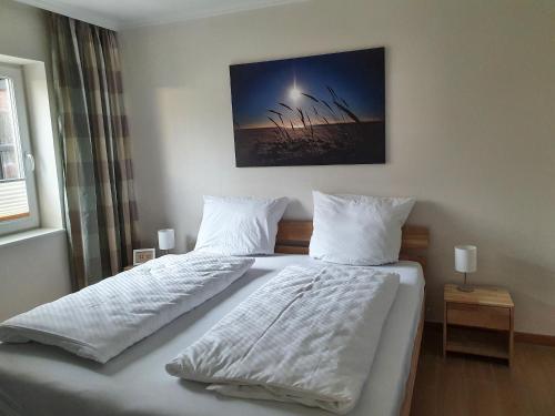 Postel nebo postele na pokoji v ubytování Haus Kap Hoorn Ferienwohnung Passat