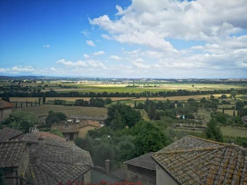 a view of a village with houses and fields at Antico Borgo di Torri in Sovicille